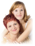Mother and her teenager daughter portrait - happy and smiling